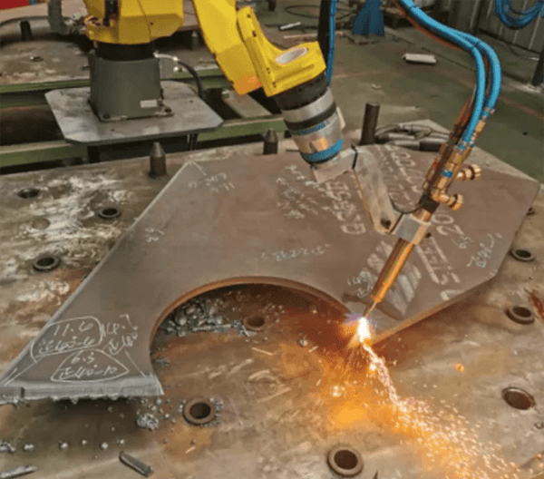 Torch cutting and beveling on a thick steel plate with a robot